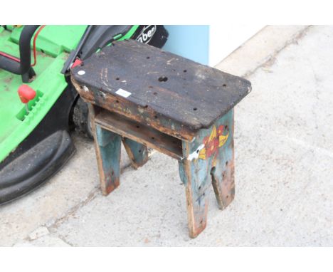 A VINTAGE WOODEN STOOL