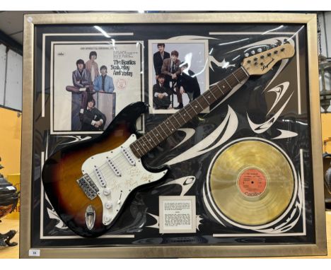 A FRAMED BEATLES MONTAGE WHICH INCLUDES A 'LEGENDS' SIGNED GUITAR, GOLD DISC, PHOTOGRAPH, ALBUM COVER ETC. SIGNATURES ARE INS