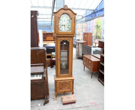 AN OAK TEMPUS FUGIT THREE WEIGHT CONTINENTAL STYLE LONGCASE CLOCK