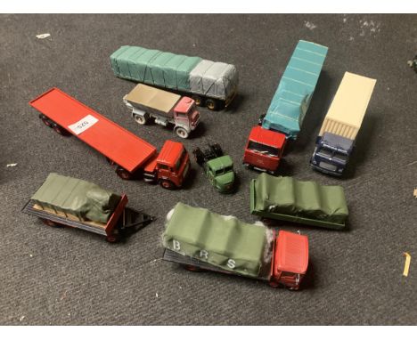 FOUR CORGI, BRITISH ROAD SERVICES TRUCKS, A TRACTOR UNIT AND THREE TRAILERS, SOME WITH LOADS
