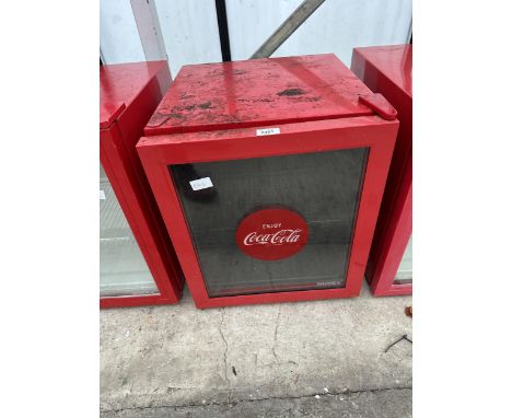 A RED HUSKY COCACOLA BOTTLE FRIDGE