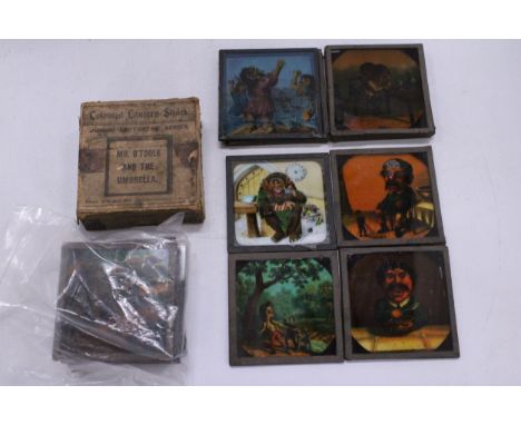 A COLLECTION OF VICTORIAN LANTERN SLIDES FEATURING MR O'TOOLE AND THE UMBRELLA AND GIANT HEADS
