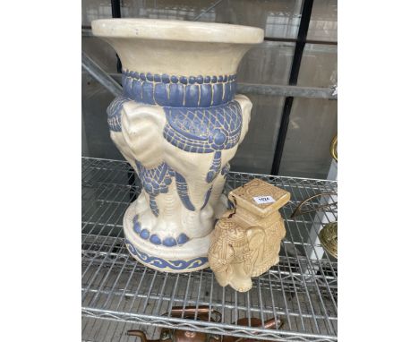 A LARGE DECORATIVE ELEPHANT CERAMIC JARDINAIRE STAND AND A FURTHER SMALL ELEPHANT STAND