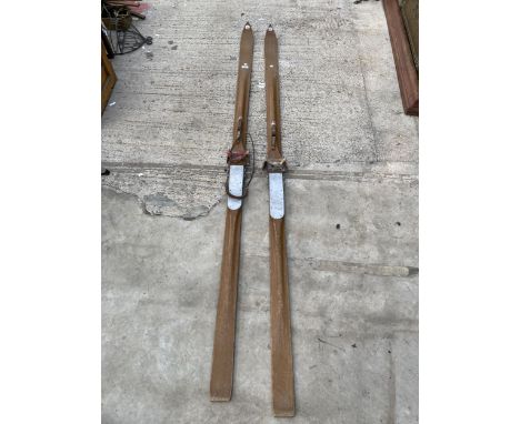 A PAIR OF VINTAGE WOODEN SANGLARD SPORTS SKIS WITH BINDINGS