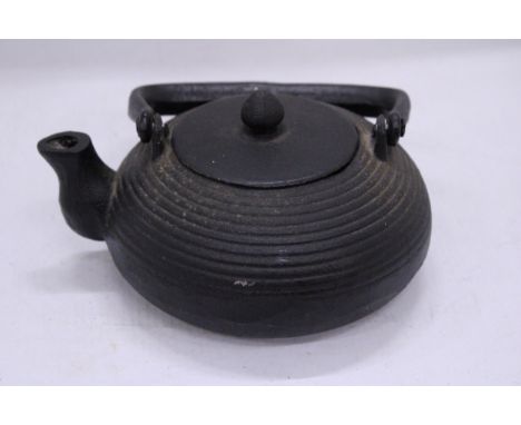 A CAST IRON JAPANESE TEAPOT