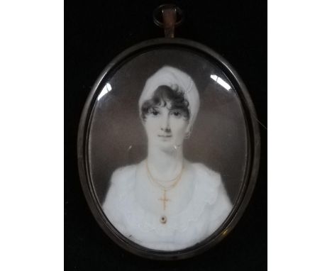 Portrait miniature of a lady on ivory in a locket frame with hair to back &amp; initials DAE in a later brass suspender frame