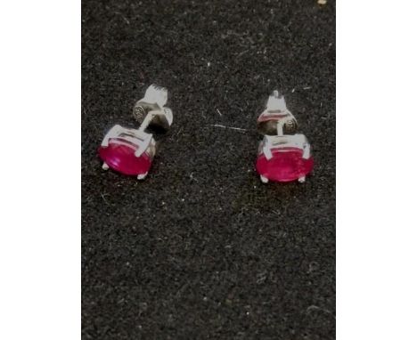 Pair of silver ruby studs (treated) 