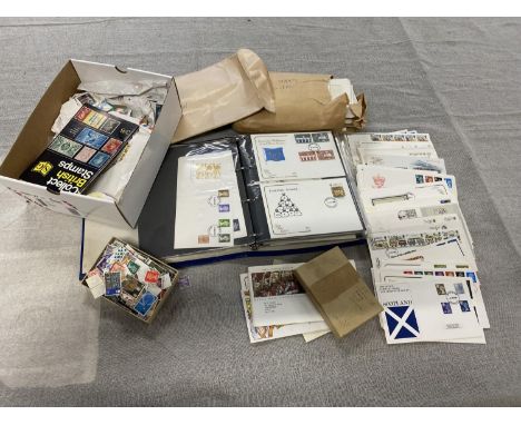 A large album of first day covers and selection of British and foreign stamps etc 