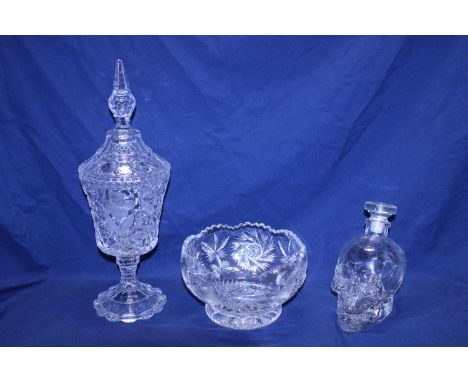 A box of assorted vintage glassware including a skull decanter 