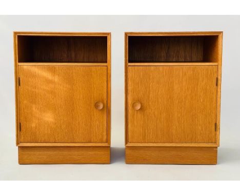 MEREDEW CABINETS, a pair, 1960s oak each with panelled door enclosing shelf, 46cm W x 36cm x 65cm H. (2) 