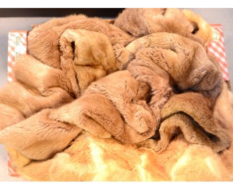 A light tan cony fur coat and a brown cony fur coat (2).