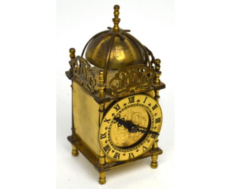 Smiths; a brass-cased electric carriage-style alarm clock with domed top, gilded dial set with Roman numerals, height 17.5cm.