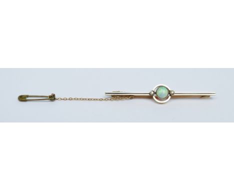 A 15ct yellow gold with white metal gilt surface Art Deco style bar brooch set with circular opal flanked by small diamonds, 