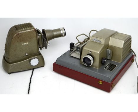 An Aldis Automatic cased slide projector with an Anastigmat lens and an earlier Aldis slide projector, in case with accessori