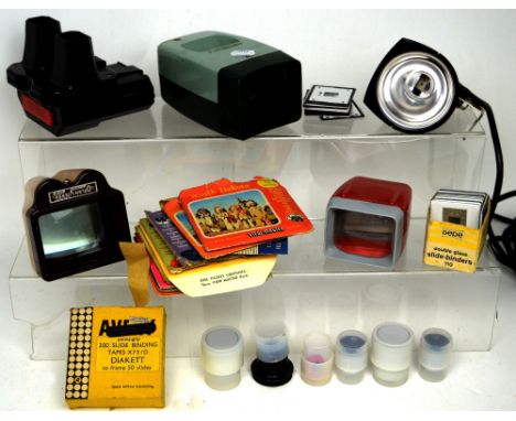 A selection of photographic slides, a box View-master stereo set, a movie light for Super 8 cameras and other slide views and