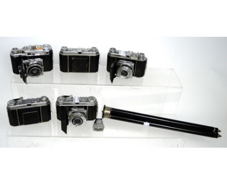 Five Kodak Retina folding cameras with Compur lenses, one with Metroaphot light meter and a vintage metal telescopic camera t
