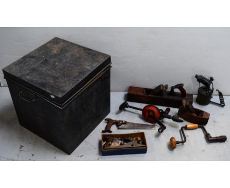 A vintage black-painted square tin chest with a small quantity of vintage tools to include a plane, block plane, bit and brac