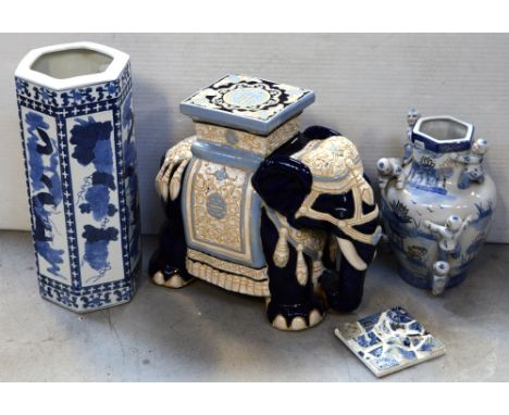 A large Oriental ceramic elephant, an Oriental stick stand, a large 20th century Oriental blue and white baluster vase, hand-