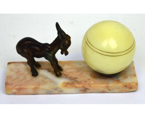 An Art Deco table lamp with yellow opaque spherical shade, with spelter donkey figure on marble base, length 24.5cm.