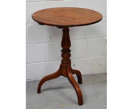 A 19th century oak circular tilt-top occasional table on tripod support, diameter 60cm.