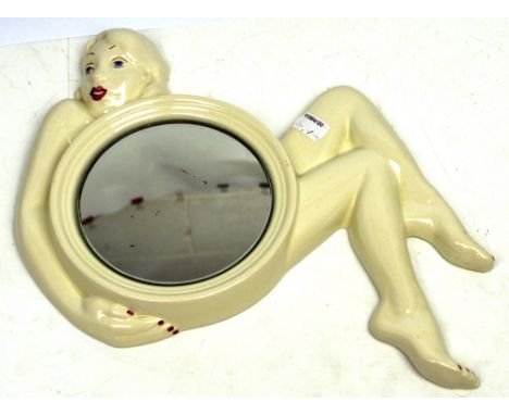 A Carltonware ceramic-framed mirror shaped as an Art Deco nude lady, length 30cm.   CONDITION REPORT  Height 24cm, good condi