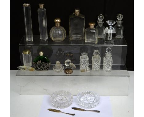 A quantity of perfume bottles to include a George V hallmarked silver-topped example with engine-turned wreath, Birmingham 19