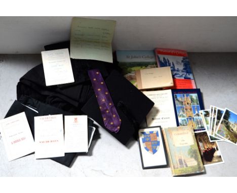 A collectors' lot, mainly Cambridge-related to include a gown, two mortarboards; one pre-1939, a Cambridge MA hood, a framed 