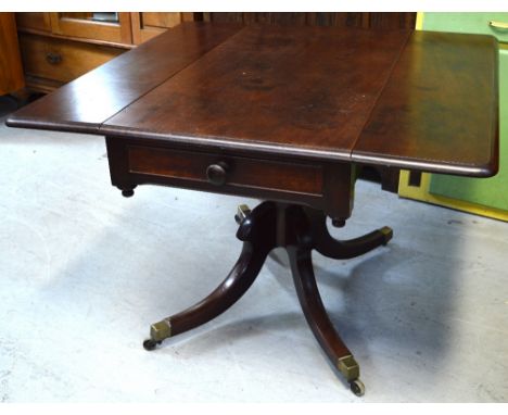 A late 19th-early 20th century mahogany sofa table on pedestal and quatrefoil supports, length when extended 106cm.