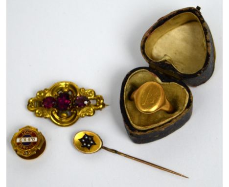 A gentlemen's 18ct gold signet ring, size H 1/2, a yellow metal stick pin set with seed pearls and tiny ruby in the form of a