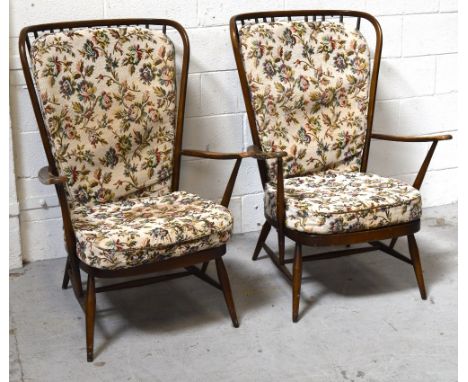 A pair of Ercol wing-back cottage armchairs (2).