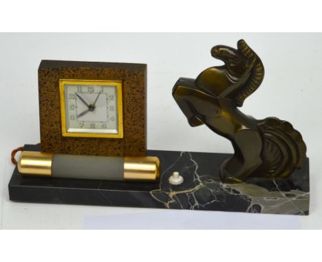 An Art Deco desk clock with light and prancing horse decoration on marble base, clock with square dial set with Arabic numera
