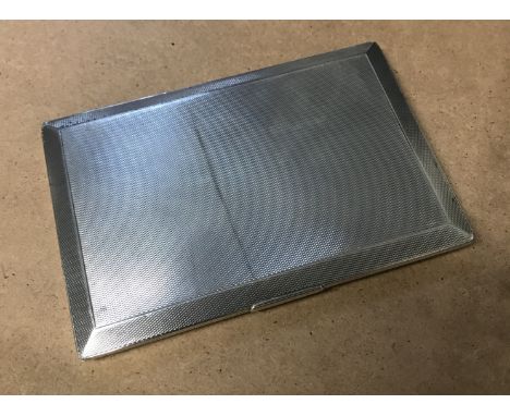 A George V hallmarked silver engine-turned cigarette case, inscribed to interior 'The members of the Insurance Institute in L