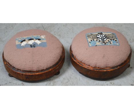 A pair of Victorian walnut circular beadwork and tapestry footstools (2).