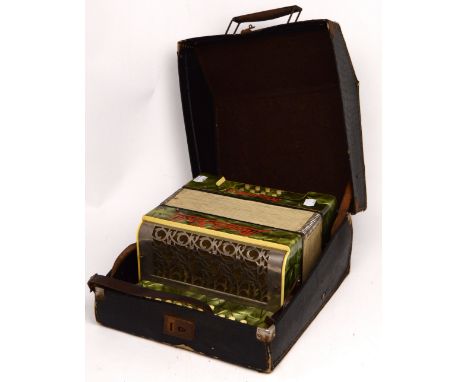 A cased German Meinel & Herald Klingenthal accordion.