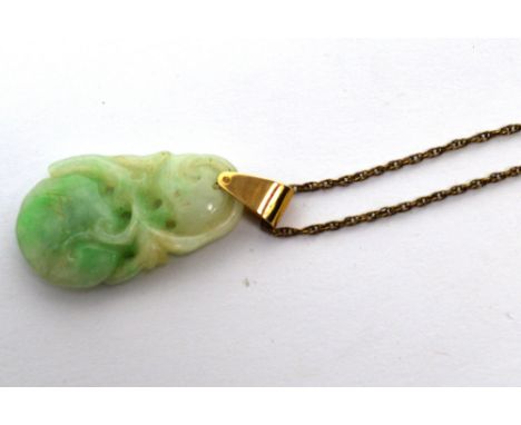 A jade pendant on a 9ct gold chain.