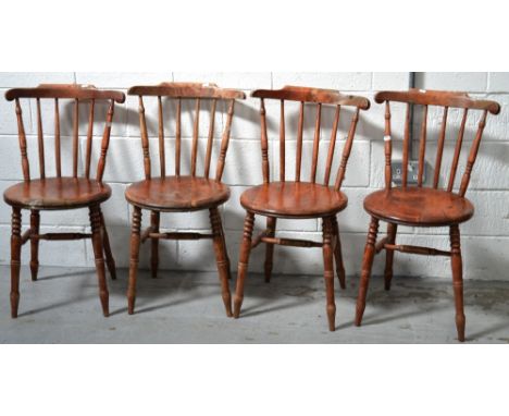 A set of four 19th century elm stick-back kitchen chairs raised on turned supports (4).