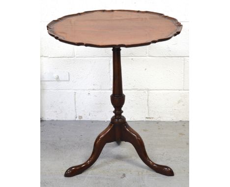 A late 19th-early 20th century mahogany circular occasional pedestal table on outswept tripod legs, diameter 56cm and a small