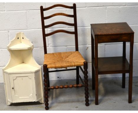 An oak ladder-back chair with raffia seat, a small oak side table and a bathroom cabinet (3).