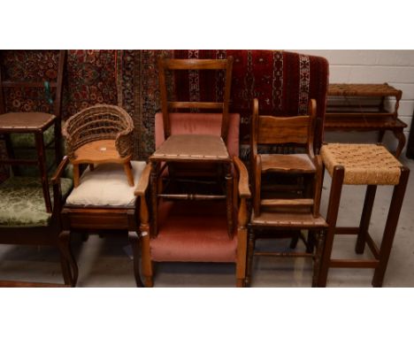 A 1930s oak armchair commode, a rattan-seated oak bar stool, an oak children's' seat, a beech armchair upholstered in pink ve