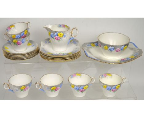 A Shelley part tea service, pattern no.023 with floral and grey decoration, comprising six cups and saucers, sugar bowl, milk