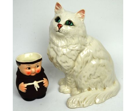 A Beswick white cat figurine with green painted eyes, marked to base 'Beswick England 1867', height 22cm and a Hummel jug in 