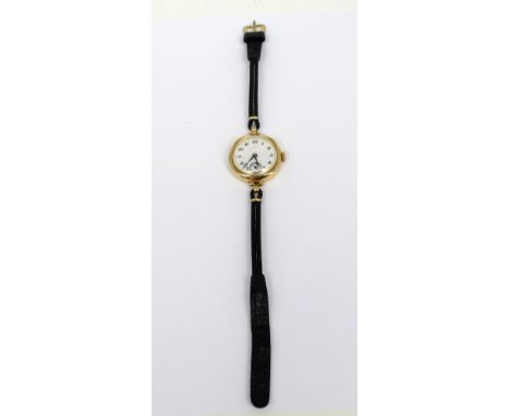 A 9ct yellow gold Cyma ladies' wristwatch, circular white enamel dial set with Arabic numerals and subsidiary seconds dial on