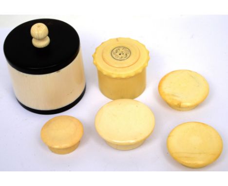 Six late 19th-early 20th century ivory trinket and patch pots to include a pot with ebony wood and top, height 5cm (6).   CON