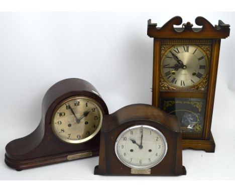 Three clocks to include a mid-20th century Napoleon hat mahogany-cased mantel clock, silvered dial set with Arabic numerals, 