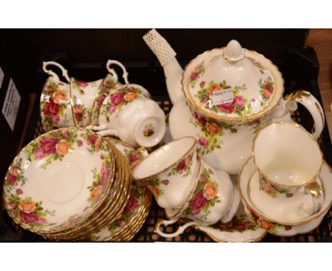 A Royal Albert 'Old Country Roses' six-place setting with teapot, side plates, cake plate.