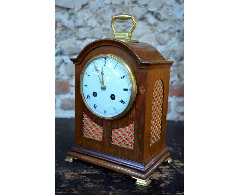 A French walnut cased 8-day mantel clock with white enamelled convex dial, striking the hour on a spiral gong
