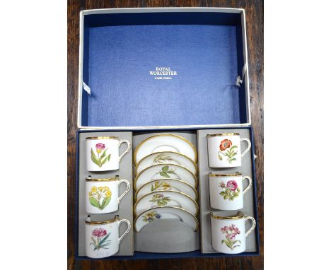 A Royal Worcester gilt edged Botanical specimen coffee service in a presentation box