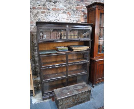 A Globe Wernicke style five section library bookcase, on a plinth base, circa 1920s, 128 cm wide x 36 cm x 176 cm high