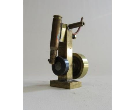 A small oscillating steam engine made using a 303 built case, brass construction and brass fly wheel (Est. plus 21% premium i