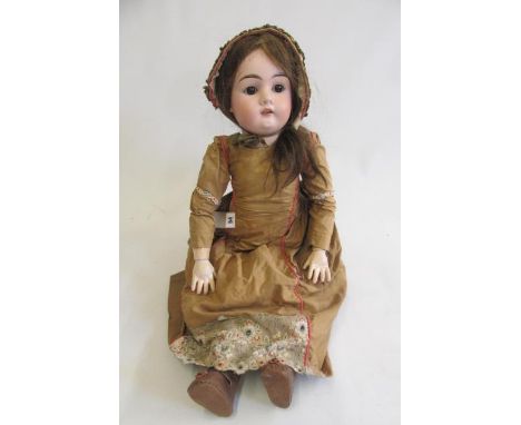 A Max Handwerck bisque socket head doll with brown glass sleeping eyes, open mouth with four moulded top teeth, brown wig, jo